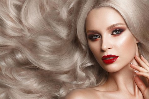 Beautiful blonde in a Hollywood manner with curls