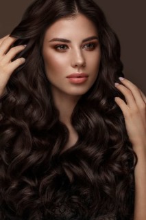 Beautiful brunette model with curls