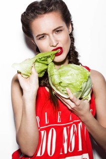 Daring funny girl with braids and red lips