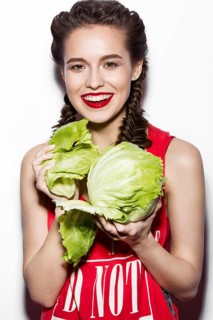 Daring funny girl with braids and red lips