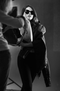 Beautiful girl posing on a photo shoot in the studio. Black and white image