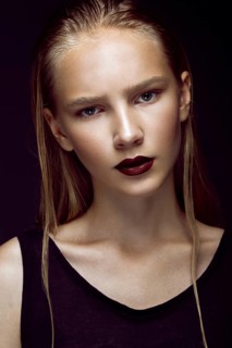 Fashion model is posing in studio for test photo shoot showing different poses