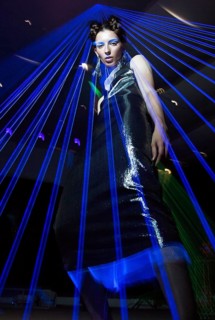 Fashion model beautiful girl in fashionable clothes in ultraviolet light