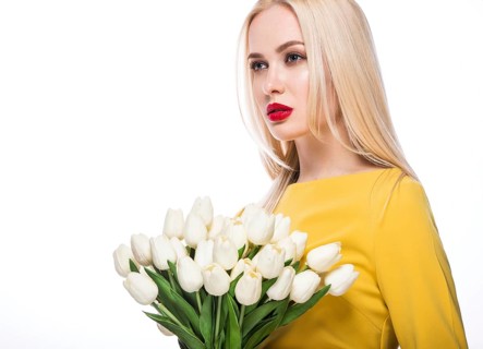 Portrait of beautiful fashion model with bouquet lily in hands