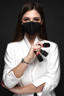 Manicurist in working form in black mask.. Nail photo content