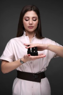 Manicurist in working form with tools in hand. Nail photo content