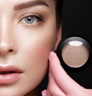 Close-up of female eyes with eyebrow shadows. Eye makeup cosmetics