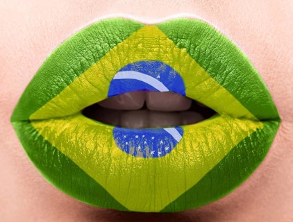 Female lips close up with a picture of the flag of Brazil. green