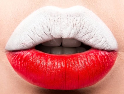 Female lips close up with a picture of the flag of Poland. white