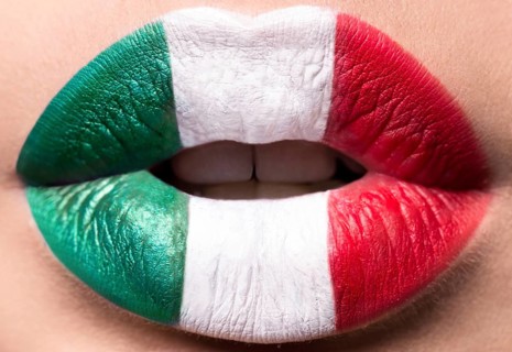 Female lips close up with a picture flag of Italy. Green