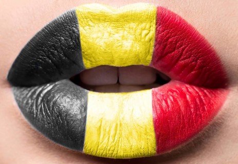 Female lips close up with a picture of the flag of Belgium. black
