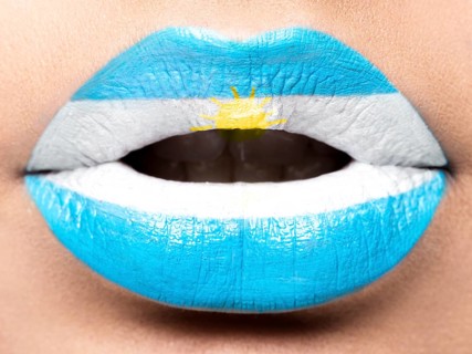 Female lips close up with a picture of the flag of Argentina. White