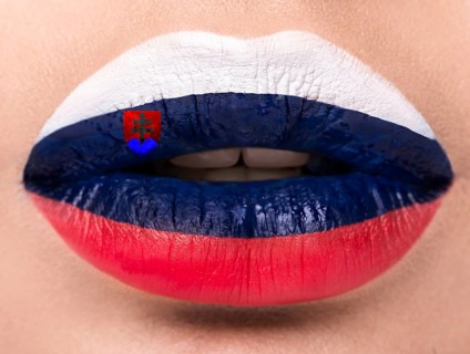 Female lips close up with a picture of the flag of Slovakia. Blue