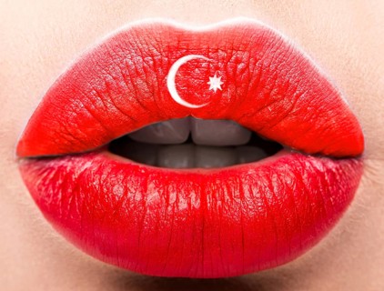 Female lips close up with a picture of the flag of Turkey. Red and white month