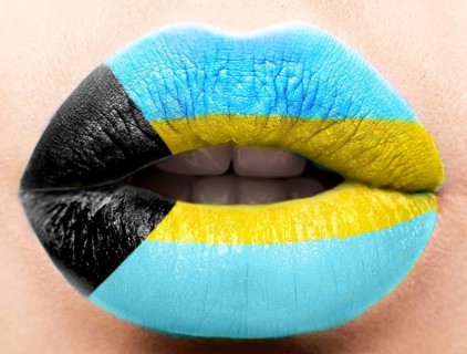 Female lips close up with a picture of the flag of Bagamy