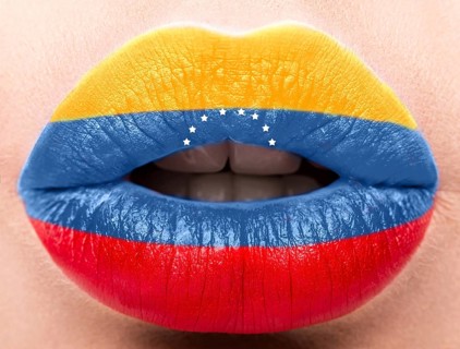 Female lips close up with a picture of the flag of Venesuela. Blue