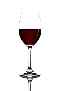 Red wine in a glass isolated on white background