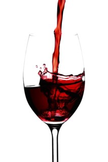 Red wine in a glass isolated on white background