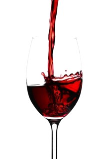 Red wine in a glass isolated on white background