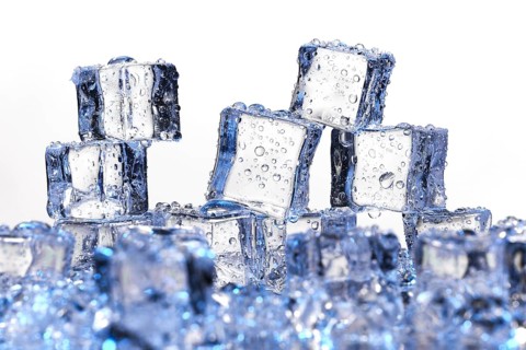 Transparent cold ice cubes on a white background