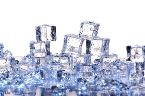 Transparent cold ice cubes on a white background