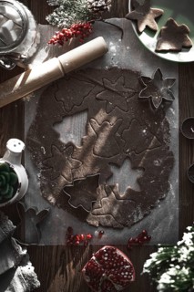 Preparing Christmas cookies. Dough on the table with baking dishes