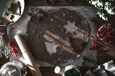 Preparing Christmas cookies. Dough on the table with baking dishes