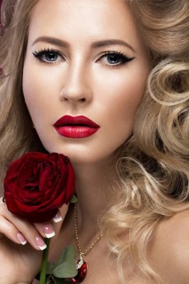 Beautiful blonde in a Hollywood manner with curls