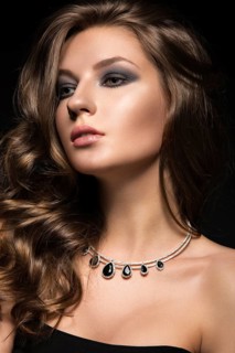 Beautiful woman with evening make-up and long straight hair