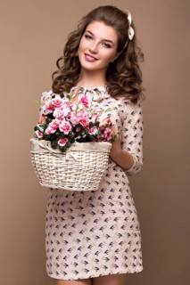 Fresh young girl in a light silk dress