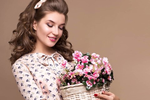 Fresh young girl in a light silk dress