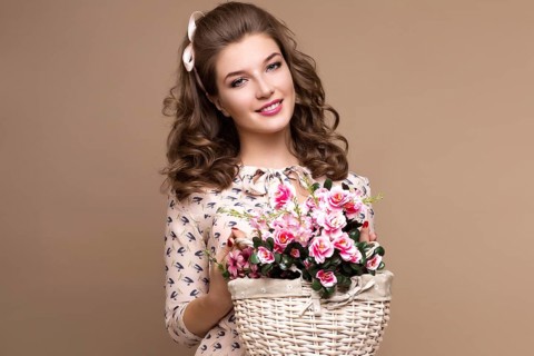 Fresh young girl in a light silk dress