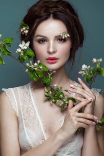 Beautiful brunette girl in lingerie with a gentle romantic make-up