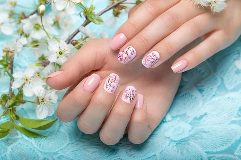 Spring manicure for the bride in gentle tones with flowers. Nail Design