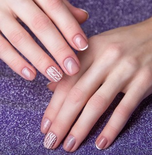 Snow White manicure on female hands. Winter nail design. Picture taken in the studio
