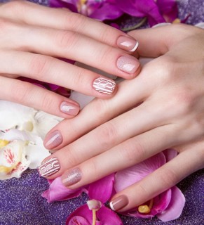 Snow White manicure on female hands. Winter nail design. Picture taken in the studio