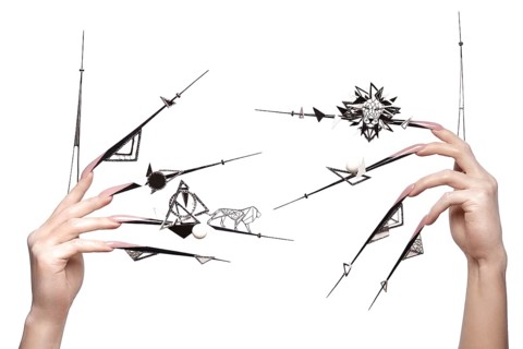 Creative design of nails on female hands. Art manicure. Photo taken in studio