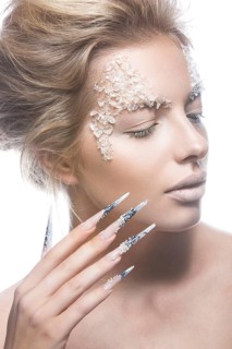 Beautiful fashion model with long nails