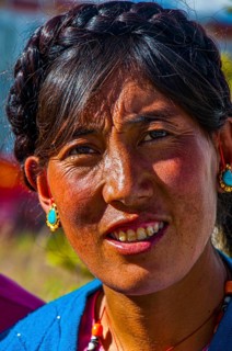 Friendly tibetan woman in the town of Ali