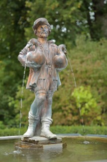 Man carrying two geese with water jet