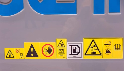Warning signs on construction machinery