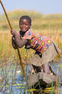 Smiling girl on canoe