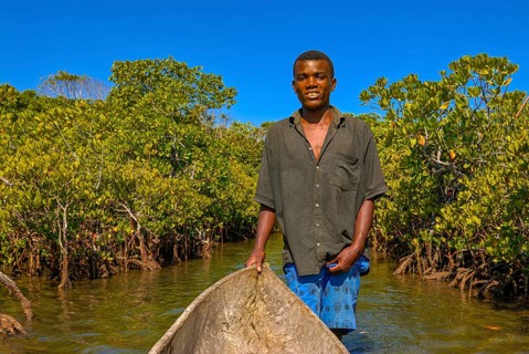 Man paddling through the mangroves of the Island Ile Sainte-Marie although Nosy Boraha