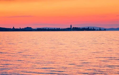Church and harbour of Romanshorn in the evening light