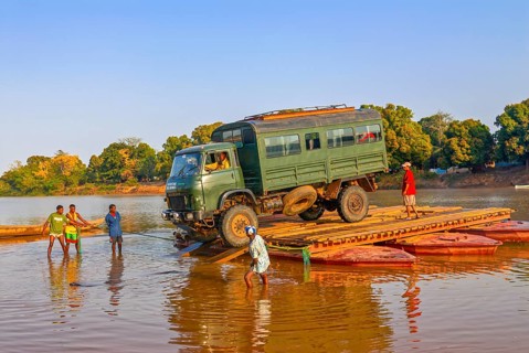Truck crossing on a improvised ferry the Manambolo river