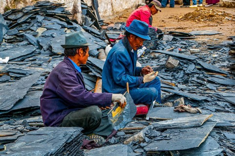 Men cracking stones