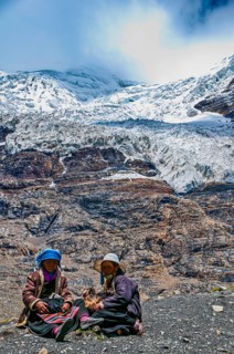 Pilgrims taking a break on the Karo-La Pass along the Friendship Highway