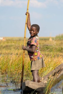 Smiling girl on canoe
