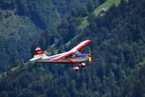 Vintage aircraft Stinson Voyager 108-2 in flight