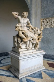 View from half left on historical sculpture in marble Marble sculpture by ancient sculptor Laocoon Group of priest Laocoon and sons fighting battle with snake